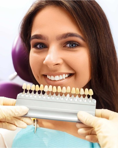 veneer in front of smiling woman